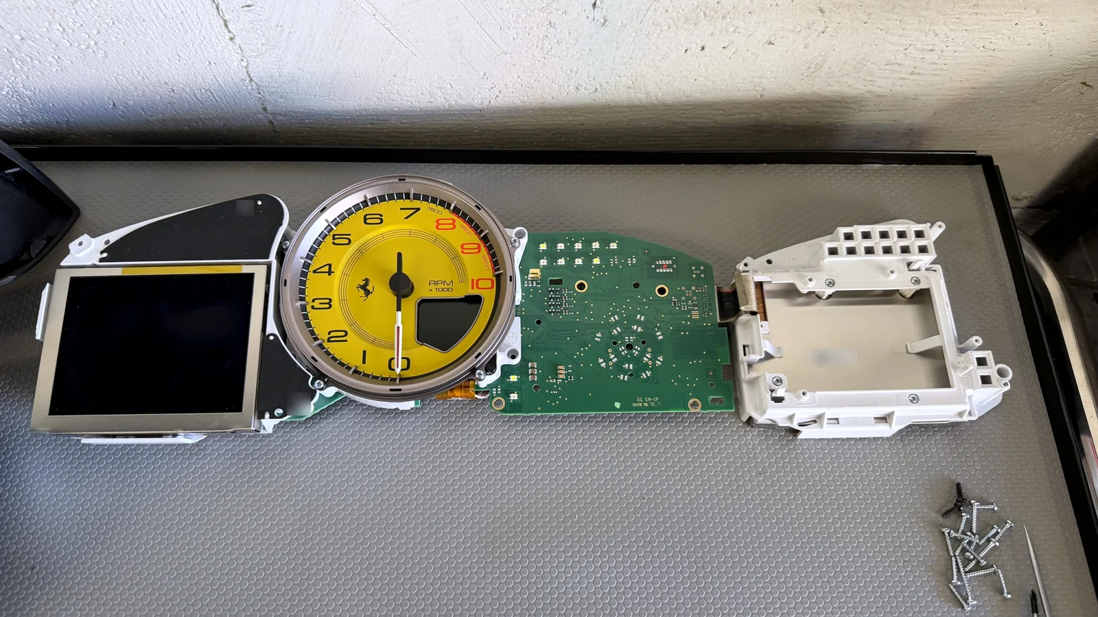 Ferrari instrument cluster opened on the workbench